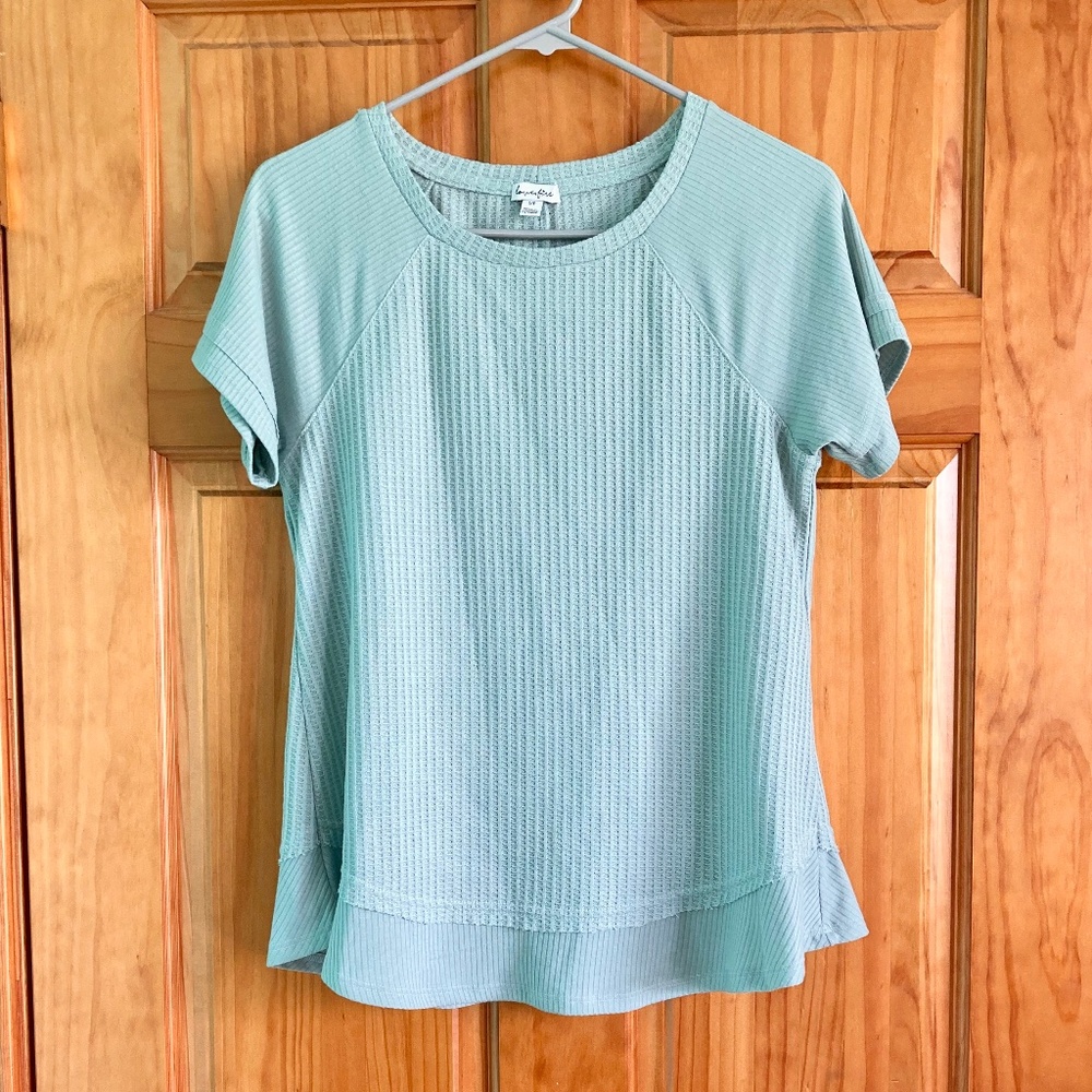 Women’s size small gently used Love Fire light teal green shirt sleeved top